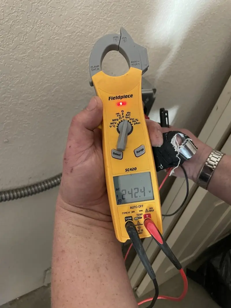 Voltage testing with clamp meter during Electrical Installation Services in Wekiwa Springs